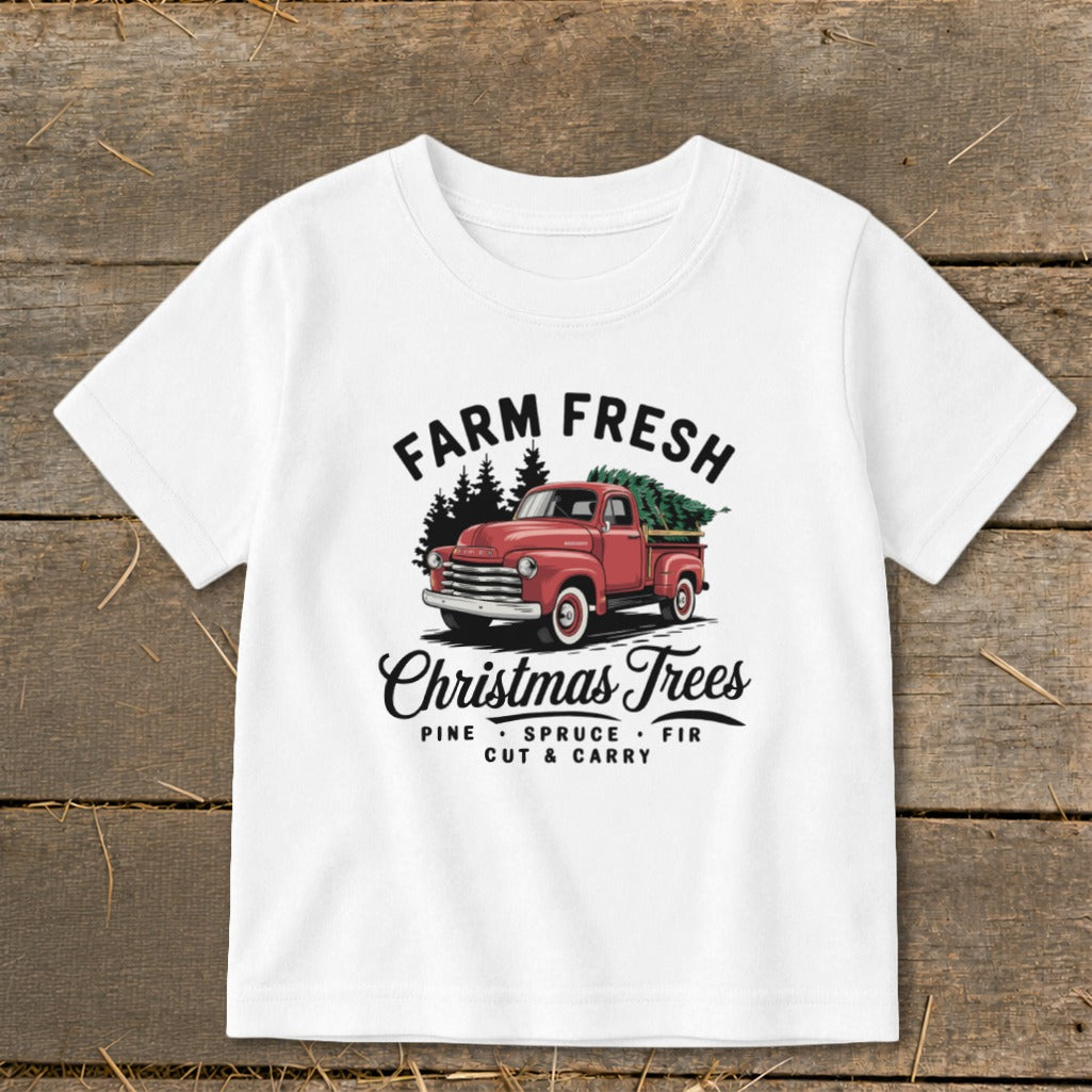 White t-shirt with "Farm Fresh Christmas Trees" graphic featuring a red truck.
