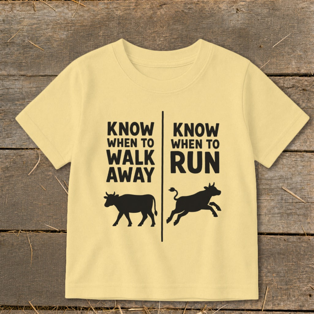 Yellow t-shirt with black text and cow graphics: "Know When To Walk Away" and "Know When To Run."