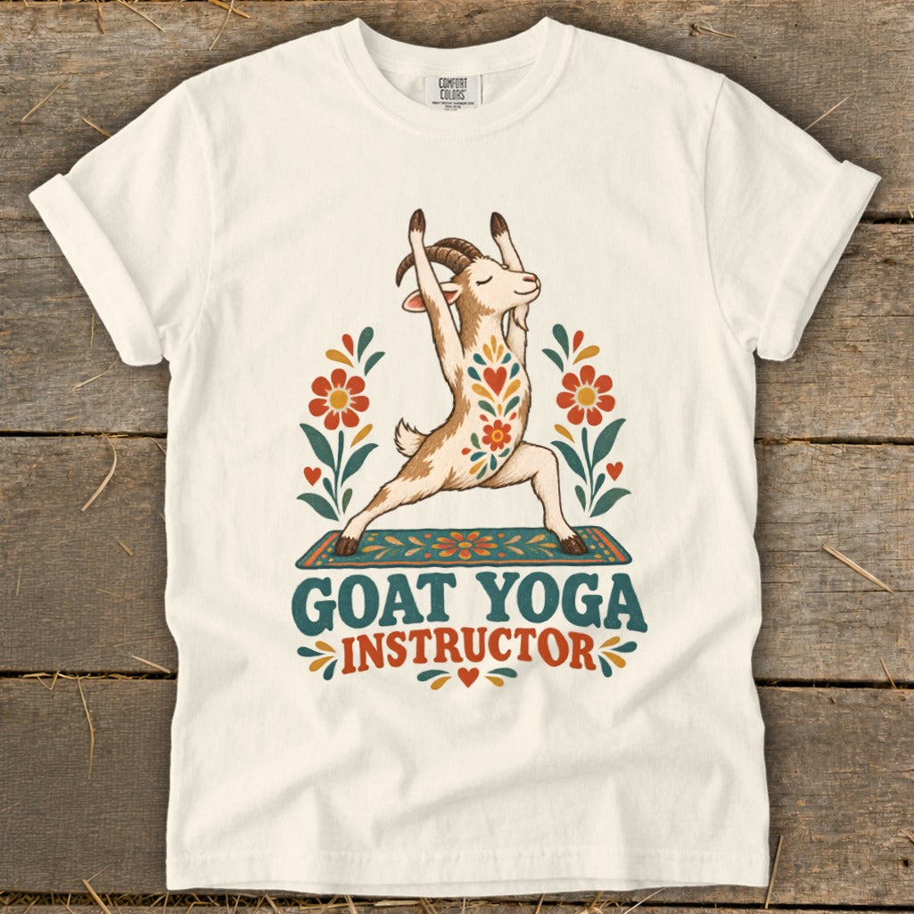Cream t-shirt with goat doing yoga and text "GOAT YOGA INSTRUCTOR".