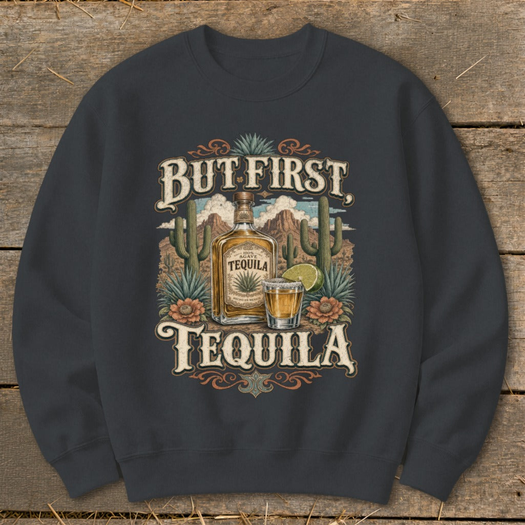 Dark gray sweatshirt with a "But First Tequila" graphic featuring a tequila bottle and shot glass.