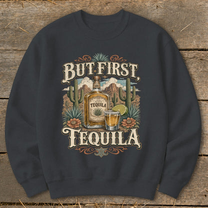 Dark gray sweatshirt with a "But First Tequila" graphic featuring a tequila bottle and shot glass.