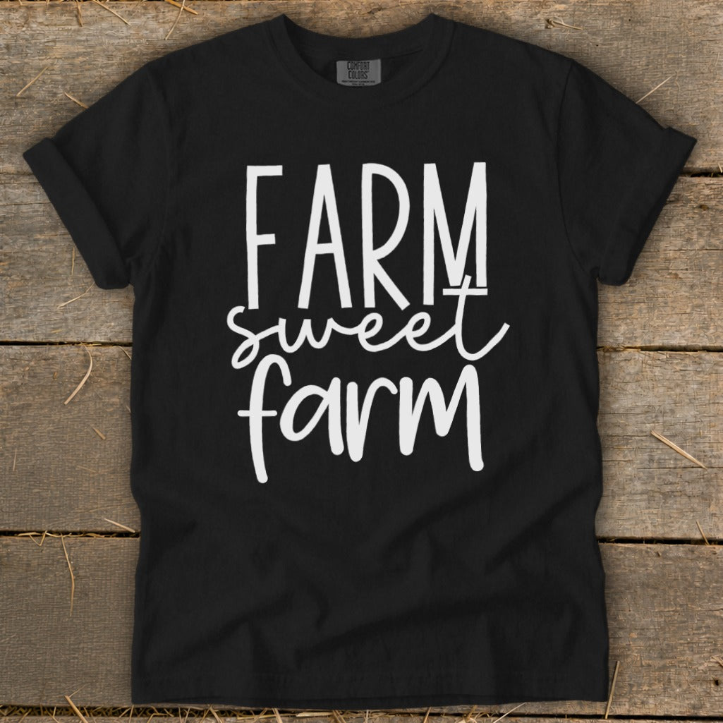 Black t-shirt with "FARM sweet farm" in white cursive font.