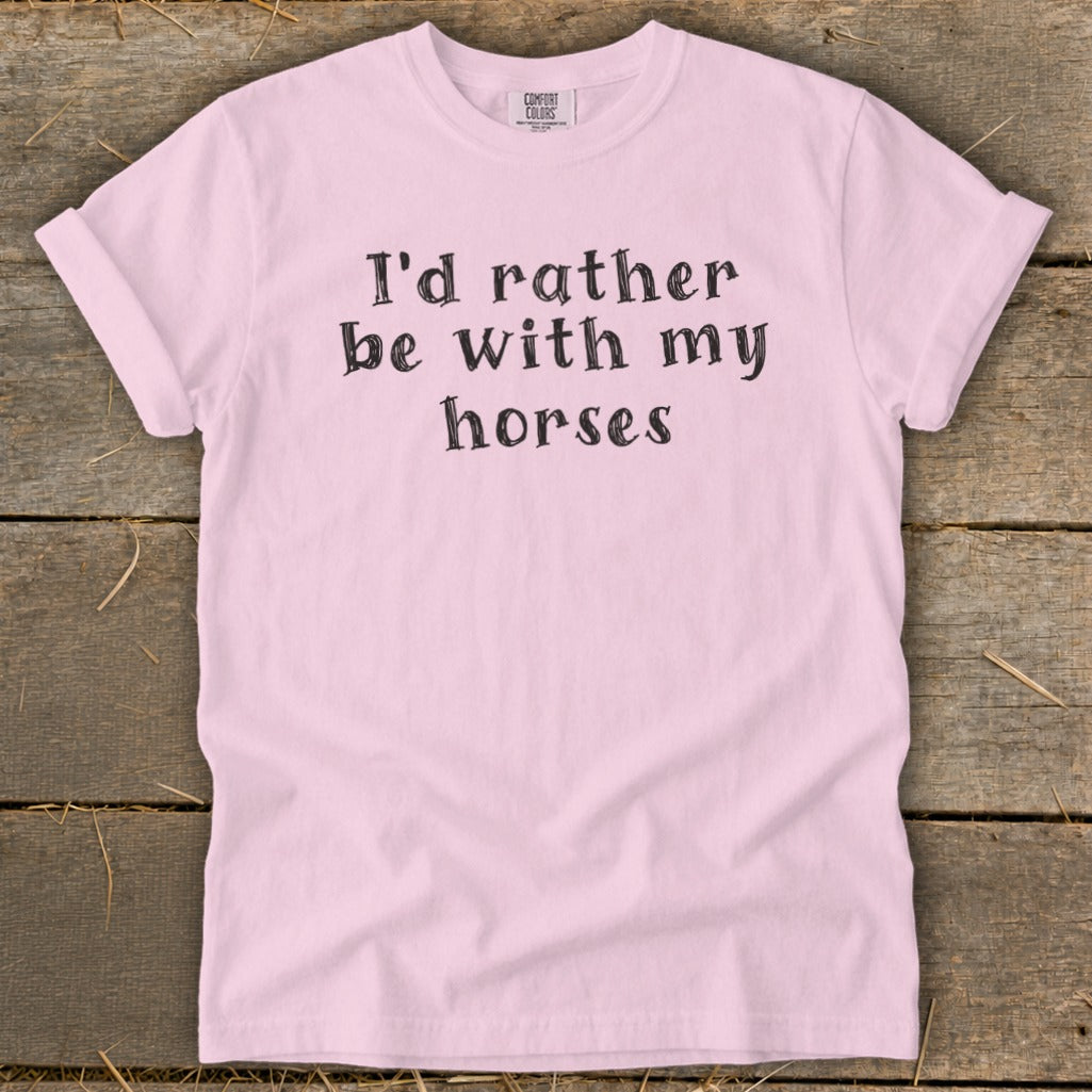 Pink t-shirt with black text that reads "I'd rather be with my horses."