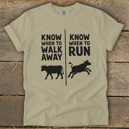 Tan t-shirt with "Know When To Walk Away" and "Know When To Run" text and cow graphics.