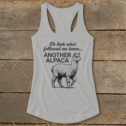 Light gray tank top with an illustration of an alpaca and the text "Oh look what followed me home... ANOTHER ALPACA".