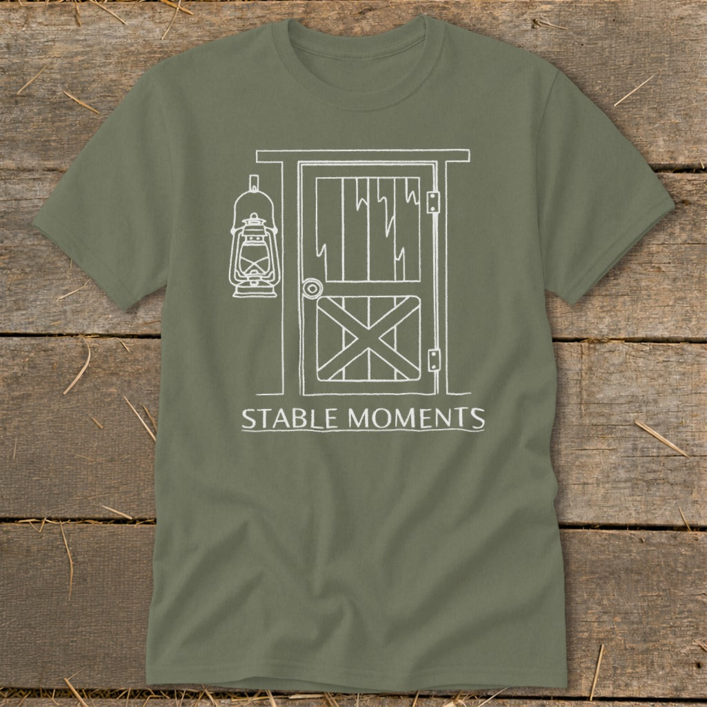 Olive t-shirt with white line art of barn door, lantern, and text "STABLE MOMENTS".