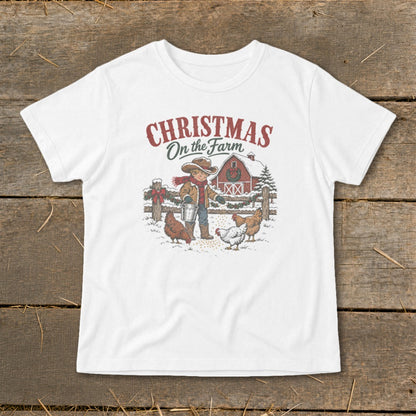 "Christmas On the Farm" graphic of a boy feeding chickens near a barn in the snow.