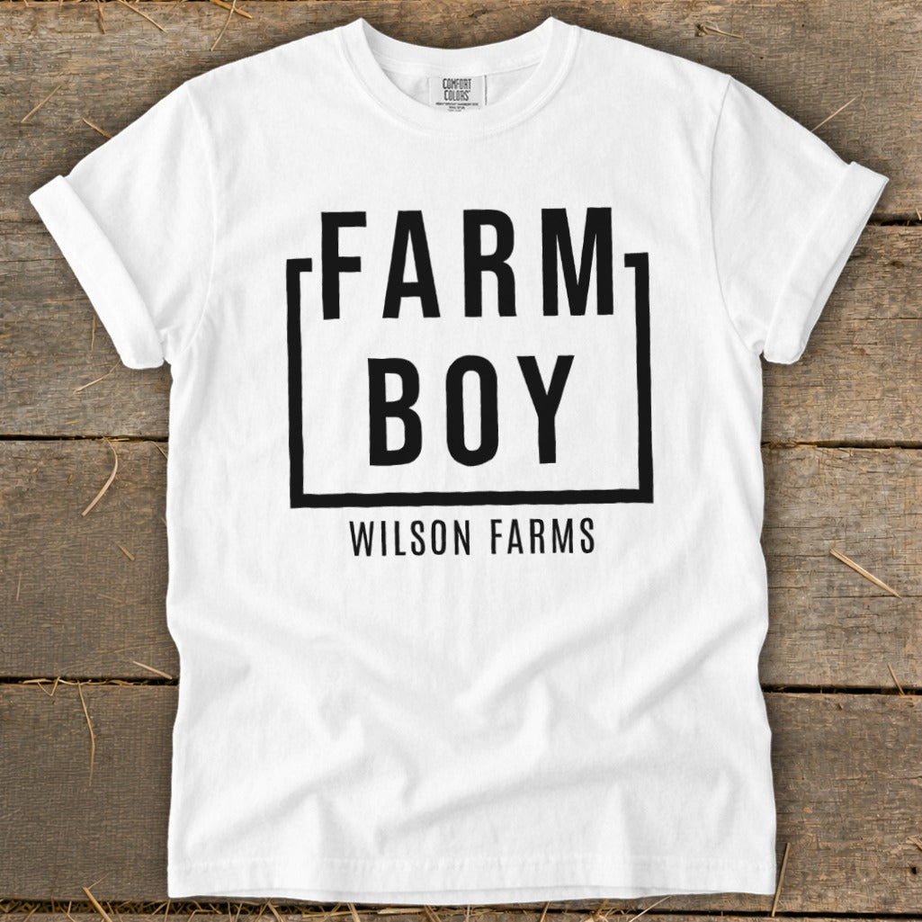 White t-shirt with "FARM BOY WILSON FARMS" in black text.