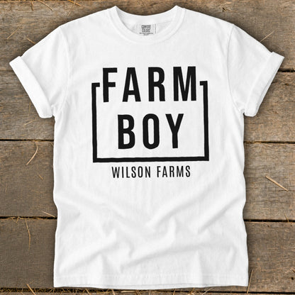 White t-shirt with "FARM BOY WILSON FARMS" in black text.