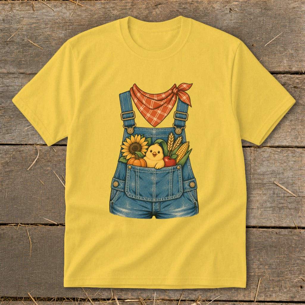 Yellow t-shirt with a denim overall design featuring a chick and fall harvest in the pocket.