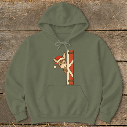 Olive green hoodie with cartoon donkey wearing a Santa hat peaking from behind a red and white striped gate.