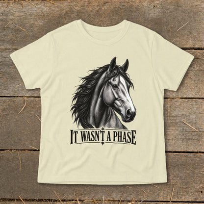 Cream t-shirt with black drawing of a horse head and text "IT WASN'T A PHASE".