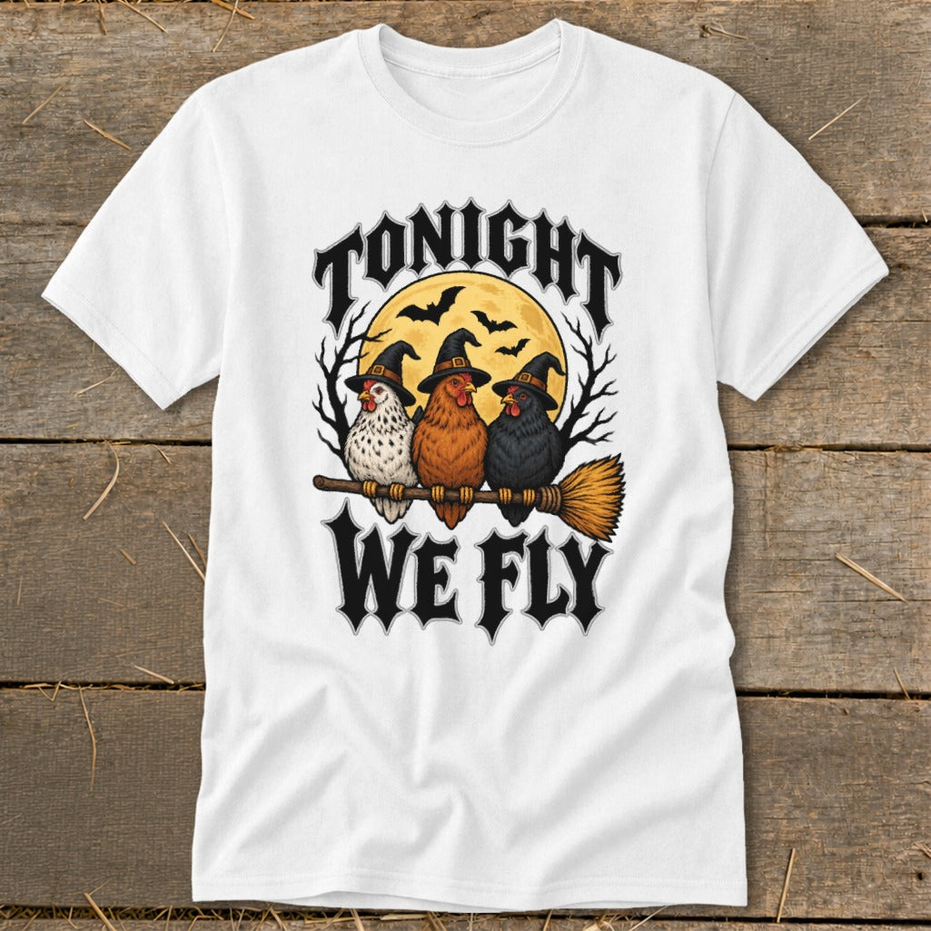 Three chickens wearing witch hats sit on a broomstick with text "TONIGHT WE FLY".