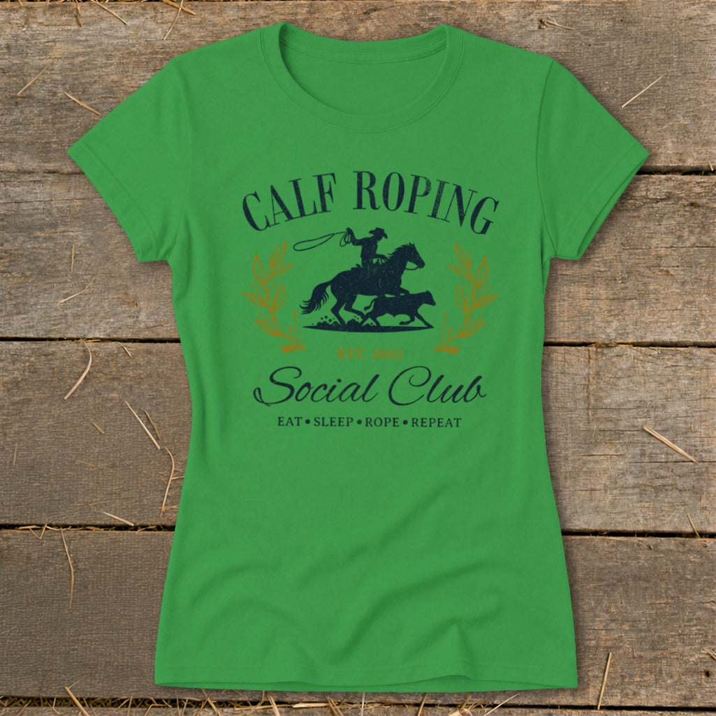 Green t-shirt with "Calf Roping Social Club" and cowboy graphic.