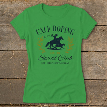 Green t-shirt with "Calf Roping Social Club" and cowboy graphic.