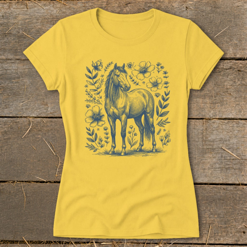 Yellow t-shirt featuring a blue sketch of a horse surrounded by flowers.