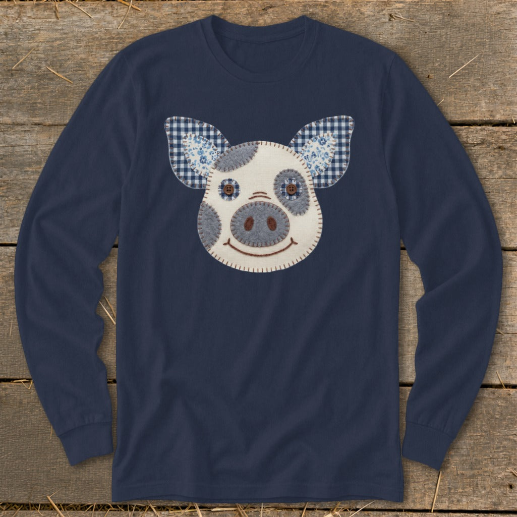 Navy long-sleeve shirt with a patchwork pig face design and gingham ears.