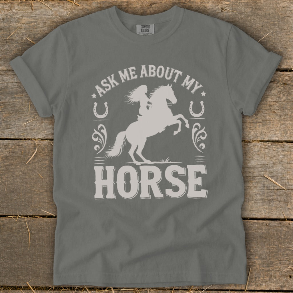 Gray t-shirt with graphic "Ask Me About My Horse" and a woman riding a horse.