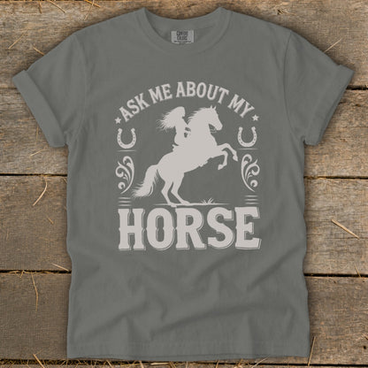 Gray t-shirt with graphic "Ask Me About My Horse" and a woman riding a horse.