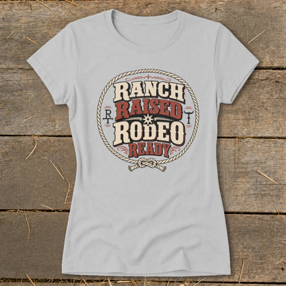Light grey t-shirt with "Ranch Raised Rodeo Ready" text inside a rope circle.