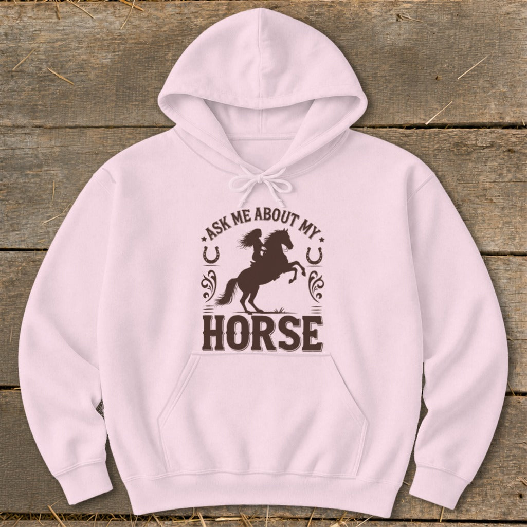 Pink hoodie with brown graphic of a rider on a horse, "Ask Me About My Horse" text.