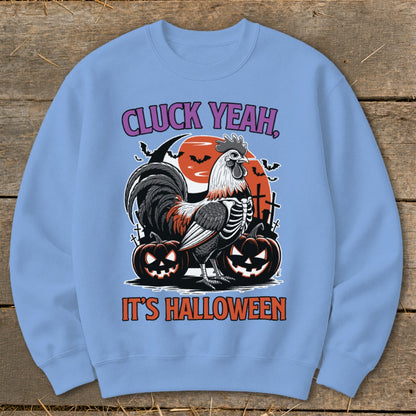 Light blue sweatshirt with Halloween graphics: rooster skeleton, pumpkins, bats, and text.