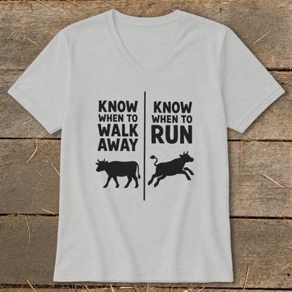 Grey v-neck shirt with "KNOW WHEN TO WALK AWAY" and "KNOW WHEN TO RUN" text and cow silhouettes.