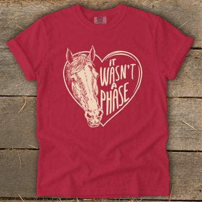 Red t-shirt with horse head inside a heart graphic and text "it wasn't a phase".