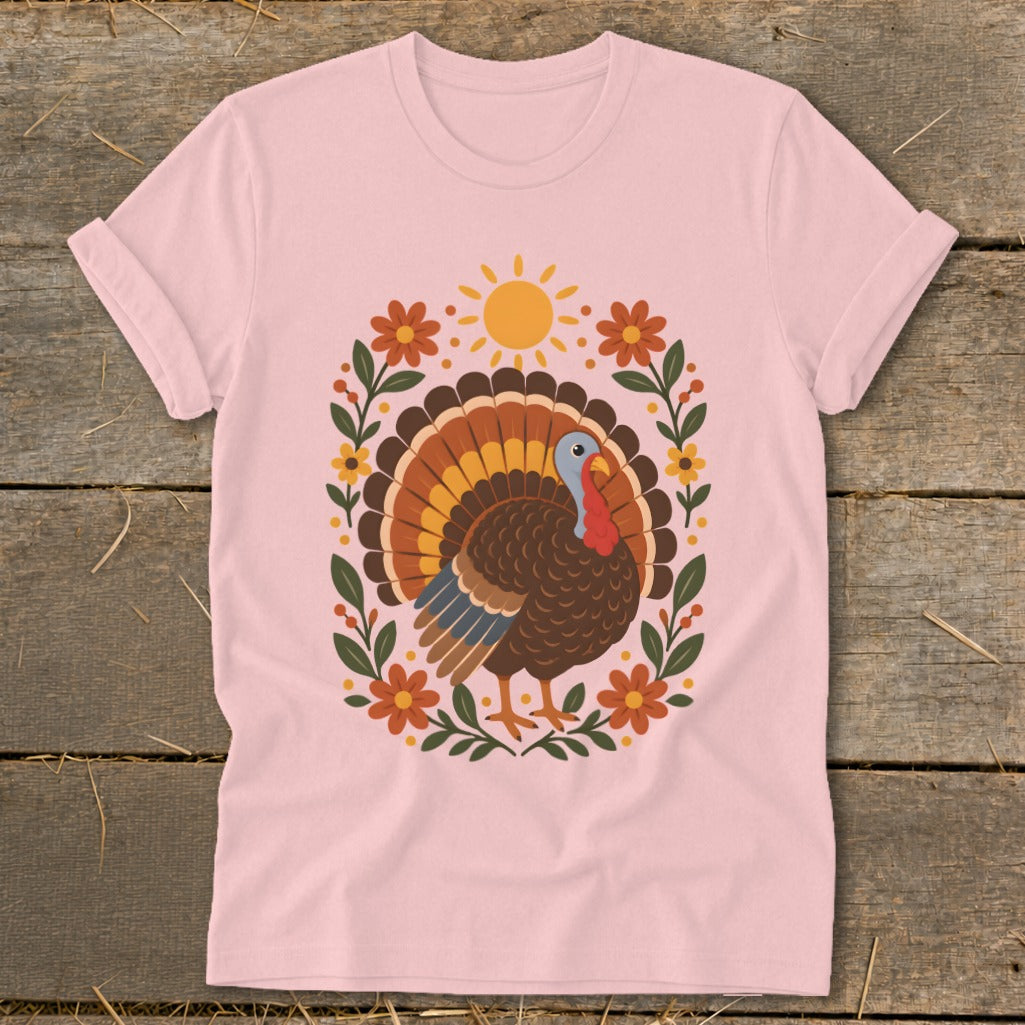 Pink t-shirt with a stylized turkey and floral design.