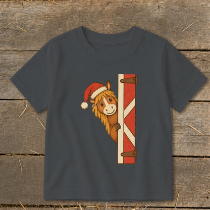 Dark grey t-shirt with a cartoon horse wearing a Santa hat peeking from behind a barn door.