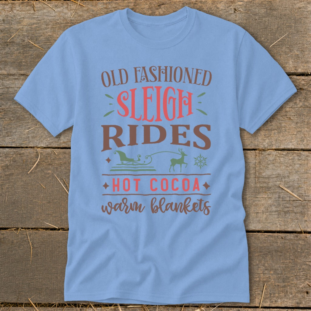 Light blue t-shirt with "Old Fashioned Sleigh Rides Hot Cocoa Warm Blankets" text.