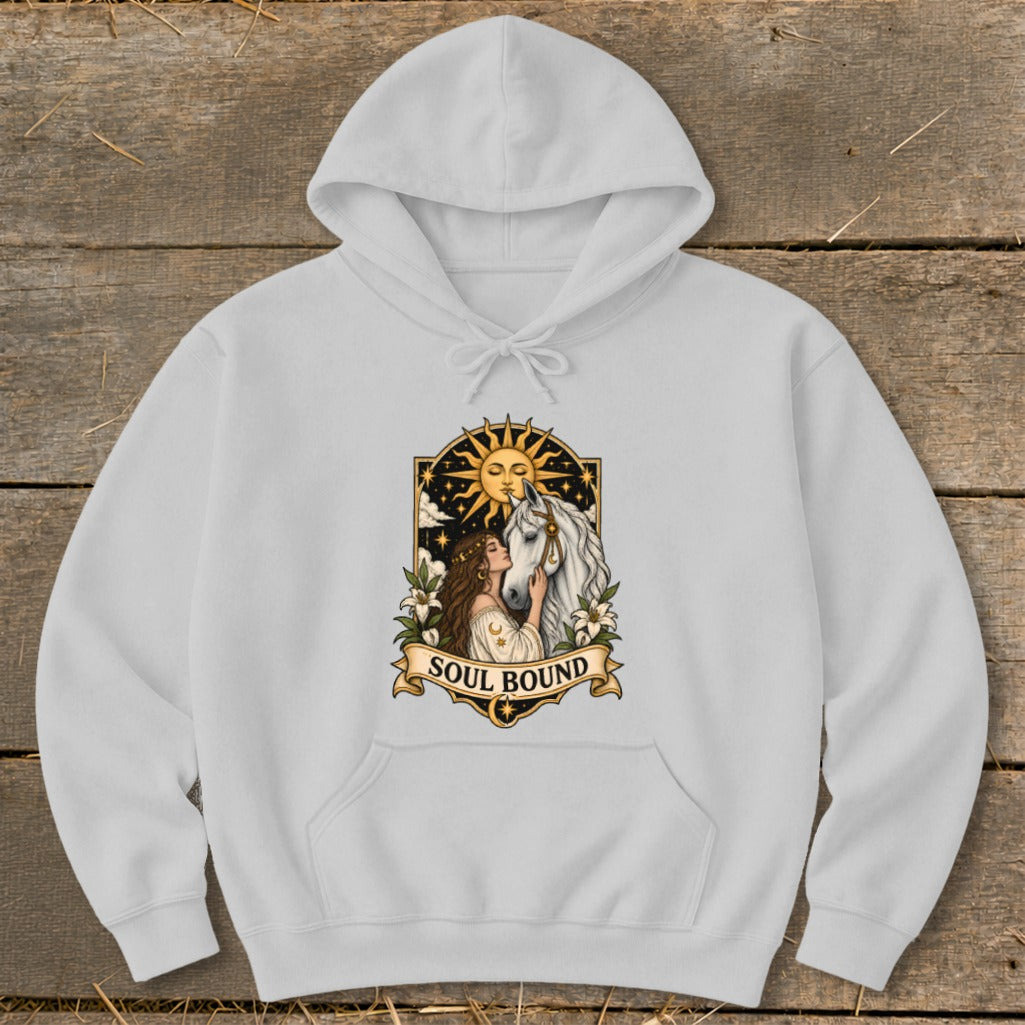 White hoodie with "Soul Bound" text and art of a woman with a horse under a sun.