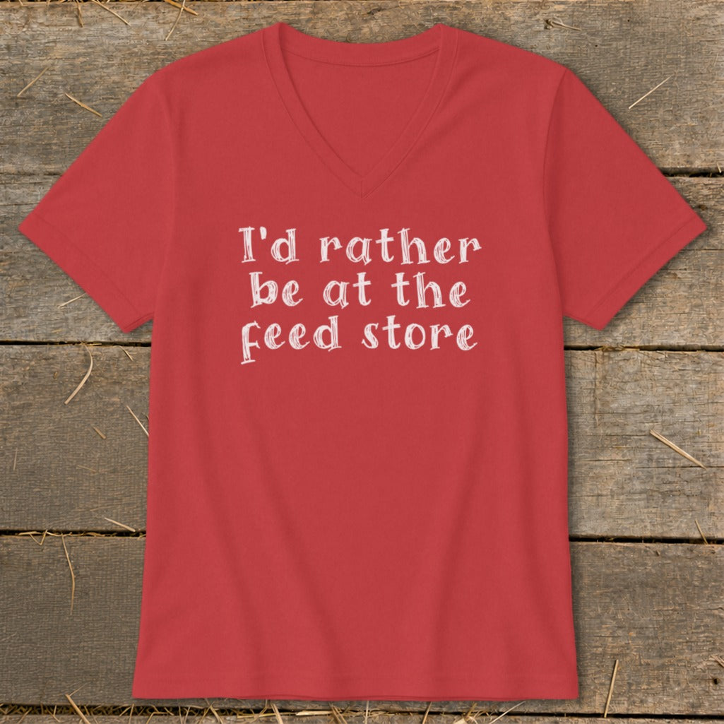 Red v-neck t-shirt with white text "I'd rather be at the feed store".