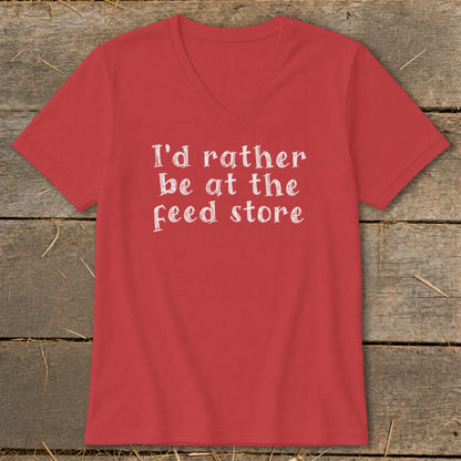 Red v-neck t-shirt with white text "I'd rather be at the feed store".