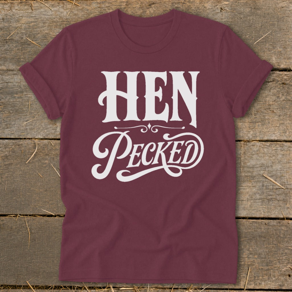 Maroon t-shirt with white "HEN PECKED" text in decorative lettering.