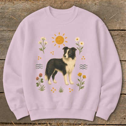 Lilac sweatshirt with a black and white border collie and floral graphics.