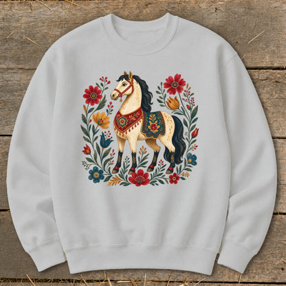 White sweatshirt with a cream horse and colorful floral design.