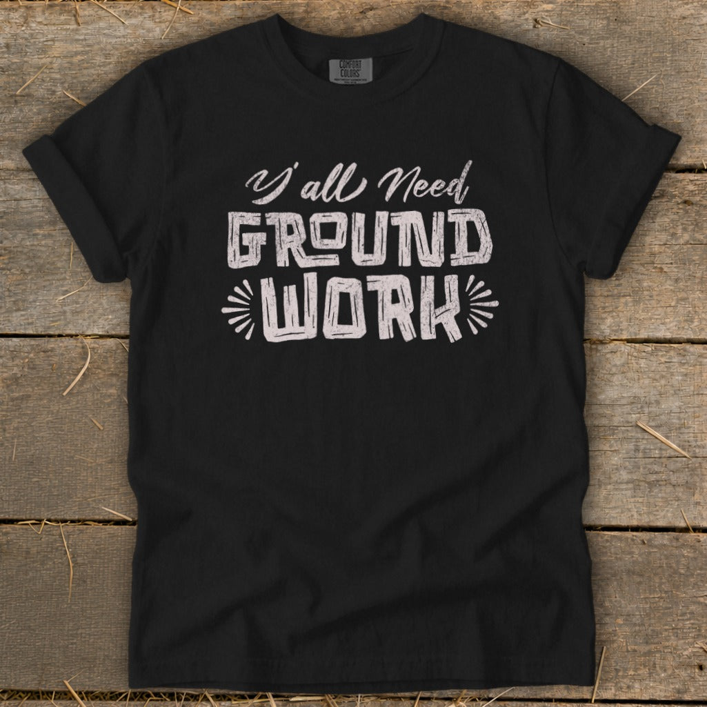 Black t-shirt with "Y'all Need GROUND WORK" text design.