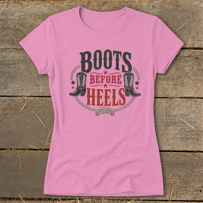 Pink t-shirt with "Boots Before Heels" graphic and cowboy boots.