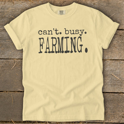Light yellow t-shirt with black text reading "can't. busy. FARMING."