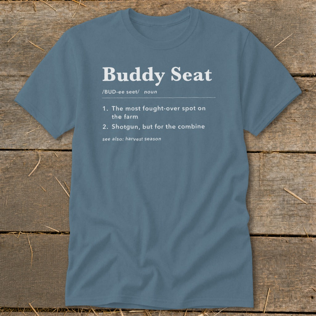 Blue t-shirt with "Buddy Seat" definition: fought-over spot on the farm.