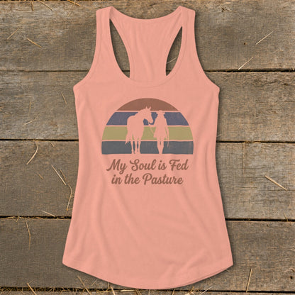 Peach tank top with horse and rider silhouette and text "My Soul is Fed in the Pasture".