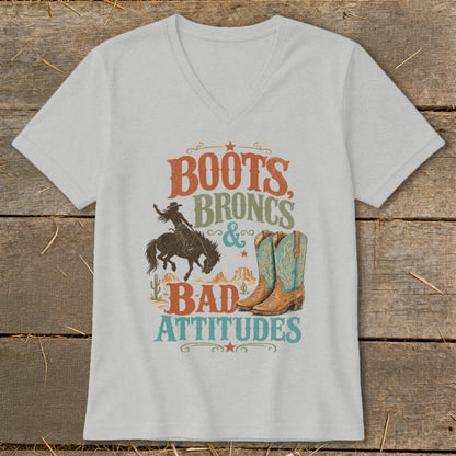 T-shirt graphic with text "Boots, Broncs & Bad Attitudes" featuring a bronc rider and cowboy boots.