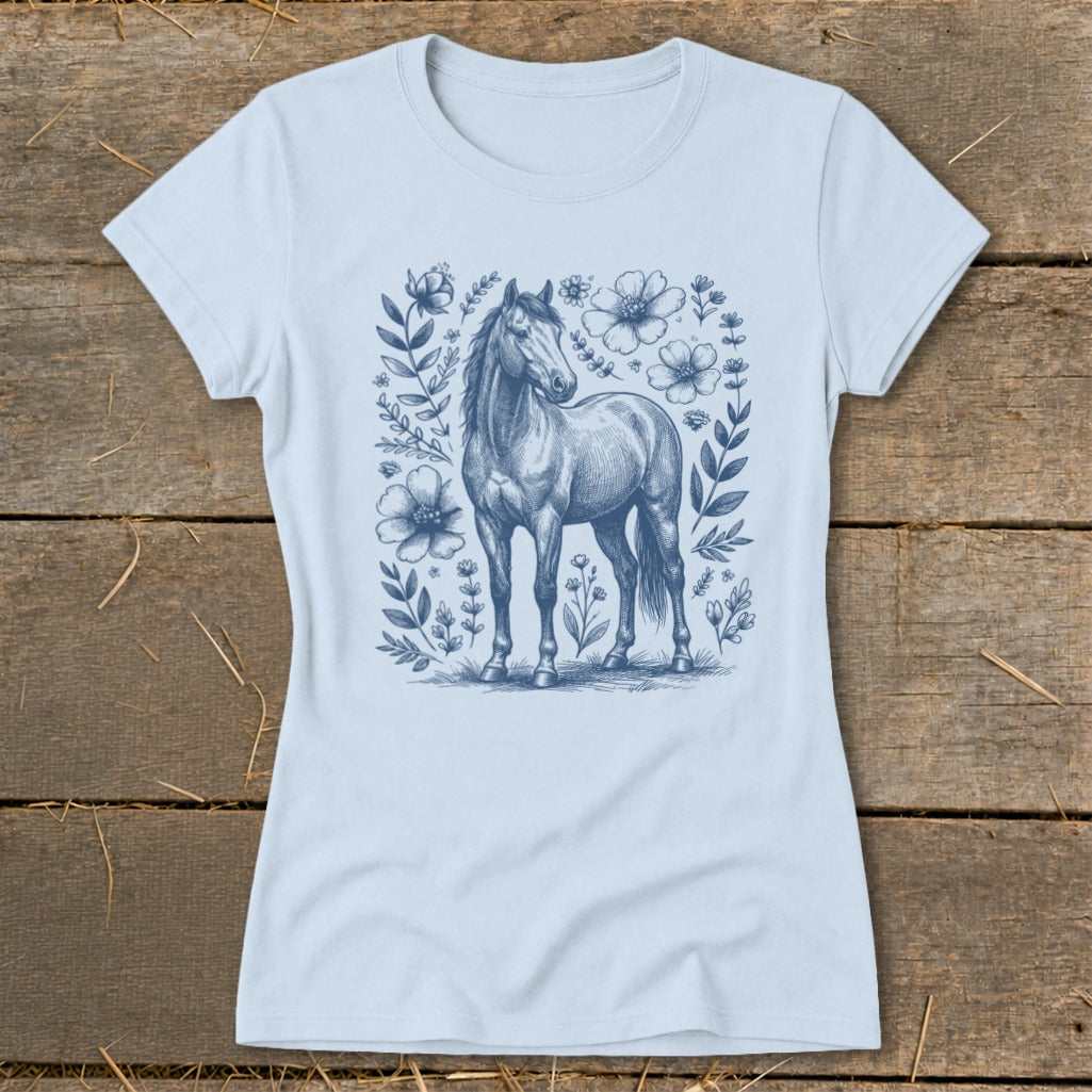 Light blue t-shirt with a blue sketch of a horse surrounded by flowers.