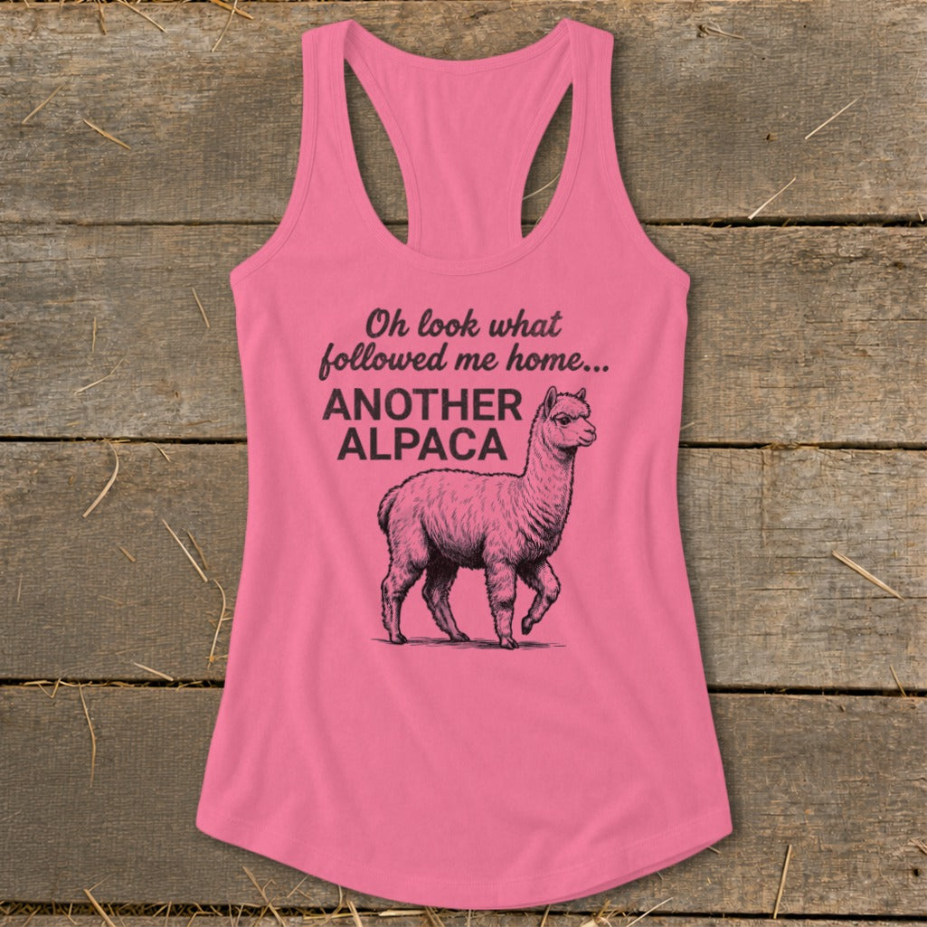 Pink tank top with an alpaca graphic and text "Oh look what followed me home... ANOTHER ALPACA."