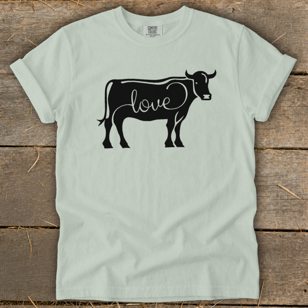 Light green t-shirt with a black silhouette of a cow with the word "love" inside.