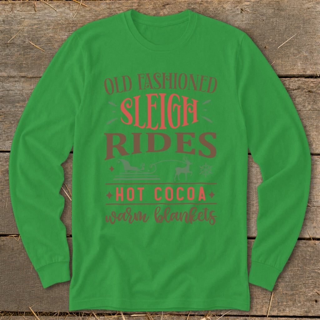 Green long-sleeve shirt with "Old Fashioned Sleigh Rides Hot Cocoa Warm Blankets" text.
