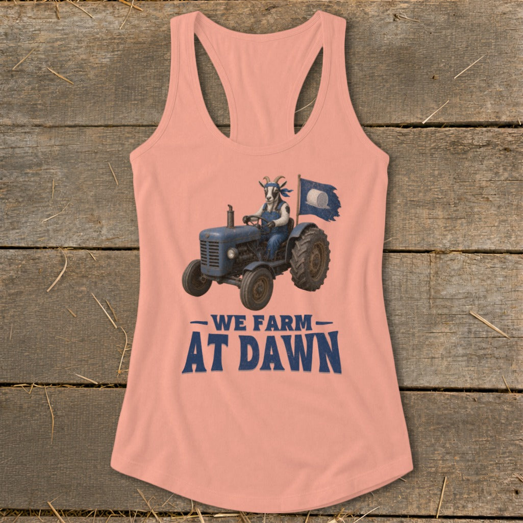 Goat wearing overalls driving a tractor with flag. "We Farm At Dawn" text.