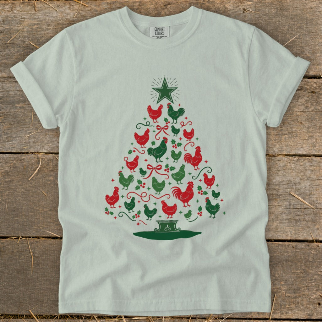 Christmas tree design made of red and green chickens on a light t-shirt.