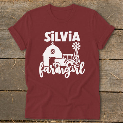 Maroon t-shirt with white "SILVIA farmgirl" text and farm graphics.
